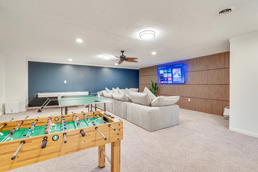 Luray Oasis game room with foosball, air hockey and sectional seating